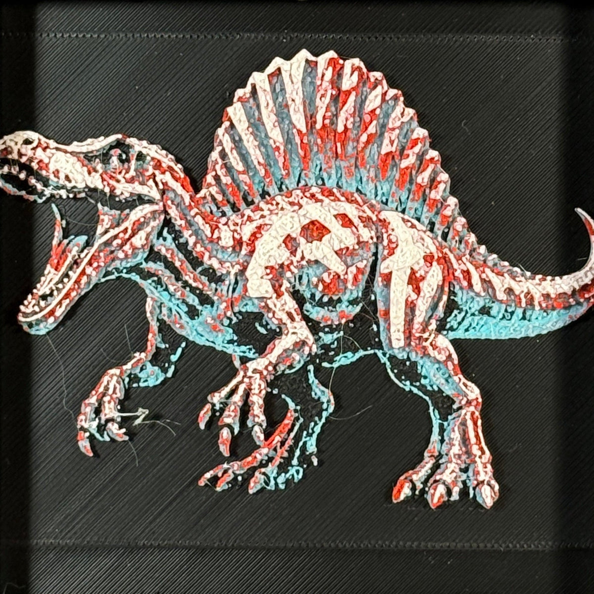 Framed geometric Spinosaurus layered 3D art piece featuring a stylized dinosaur design in a vibrant Crimson Ice color palette.
