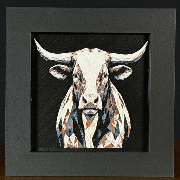 Geometric steer framed layered 3D art in Heritage color palette, featuring a bold steer portrait with soft white, gray, black, and neutral brown layered details inside a charcoal matte display frame.