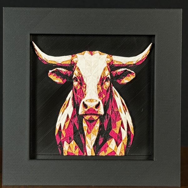 Geometric steer framed layered 3D art in Royal Gold color palette, featuring a bold steer portrait with gold, blue, black, and white layered details inside a charcoal matte display frame.