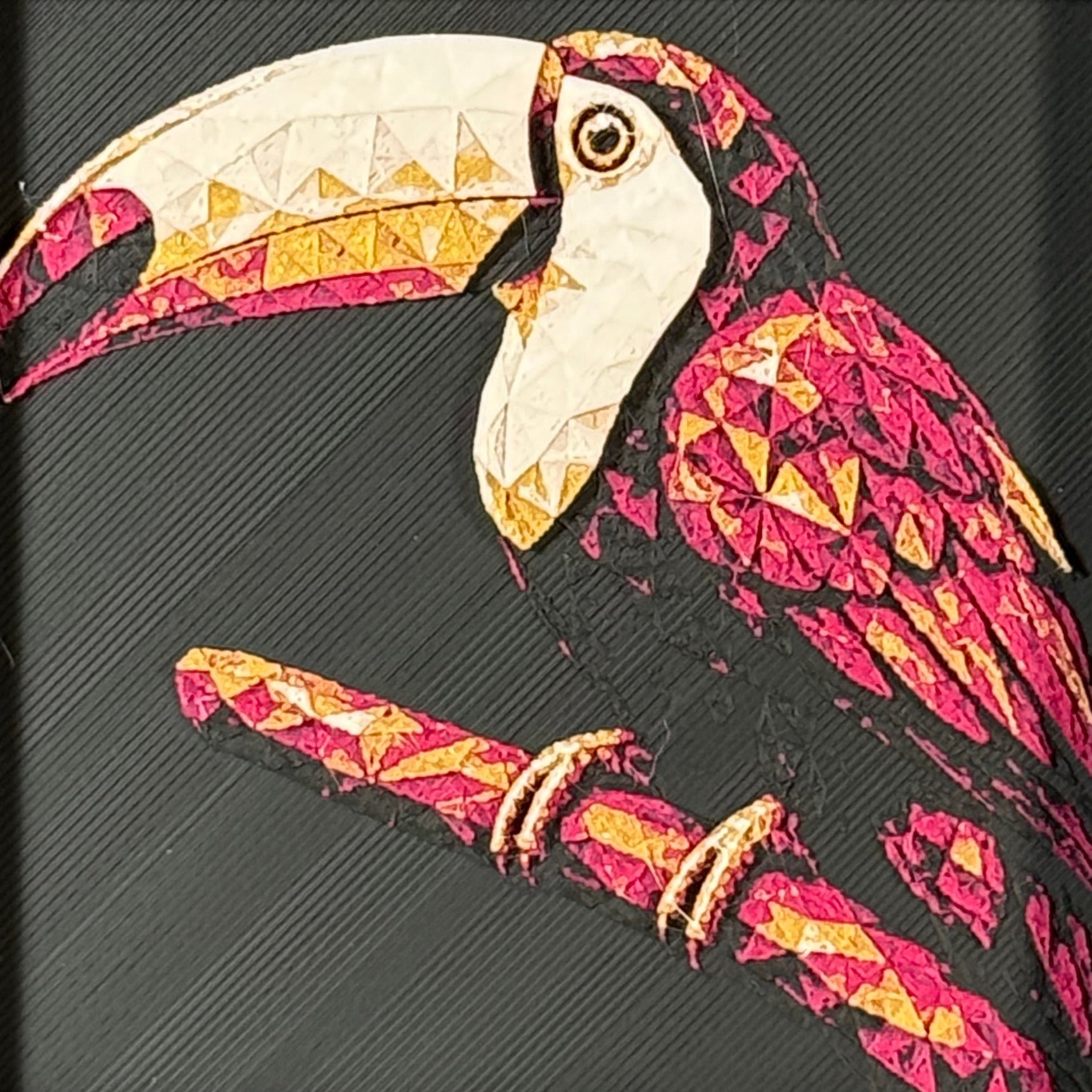 Geometric toucan framed layered 3D art in Royal Gold color palette, featuring a toucan portrait with gold, blue, black, and white layered details inside a charcoal matte display frame.