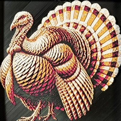Geometric turkey framed layered 3D art in Royal Gold color palette, featuring a turkey portrait with gold, blue, black, and white layered details inside a charcoal matte display frame.
