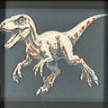 Framed geometric Velociraptor layered 3D art piece featuring a stylized dinosaur design in a rich Heritage color palette.