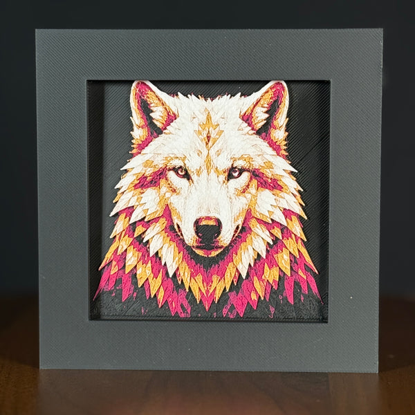 Geometric wolf framed layered 3D art in Crimson Ice color palette, featuring a bold wolf portrait with cyan, red, black, and white layered details inside a charcoal matte display frame.