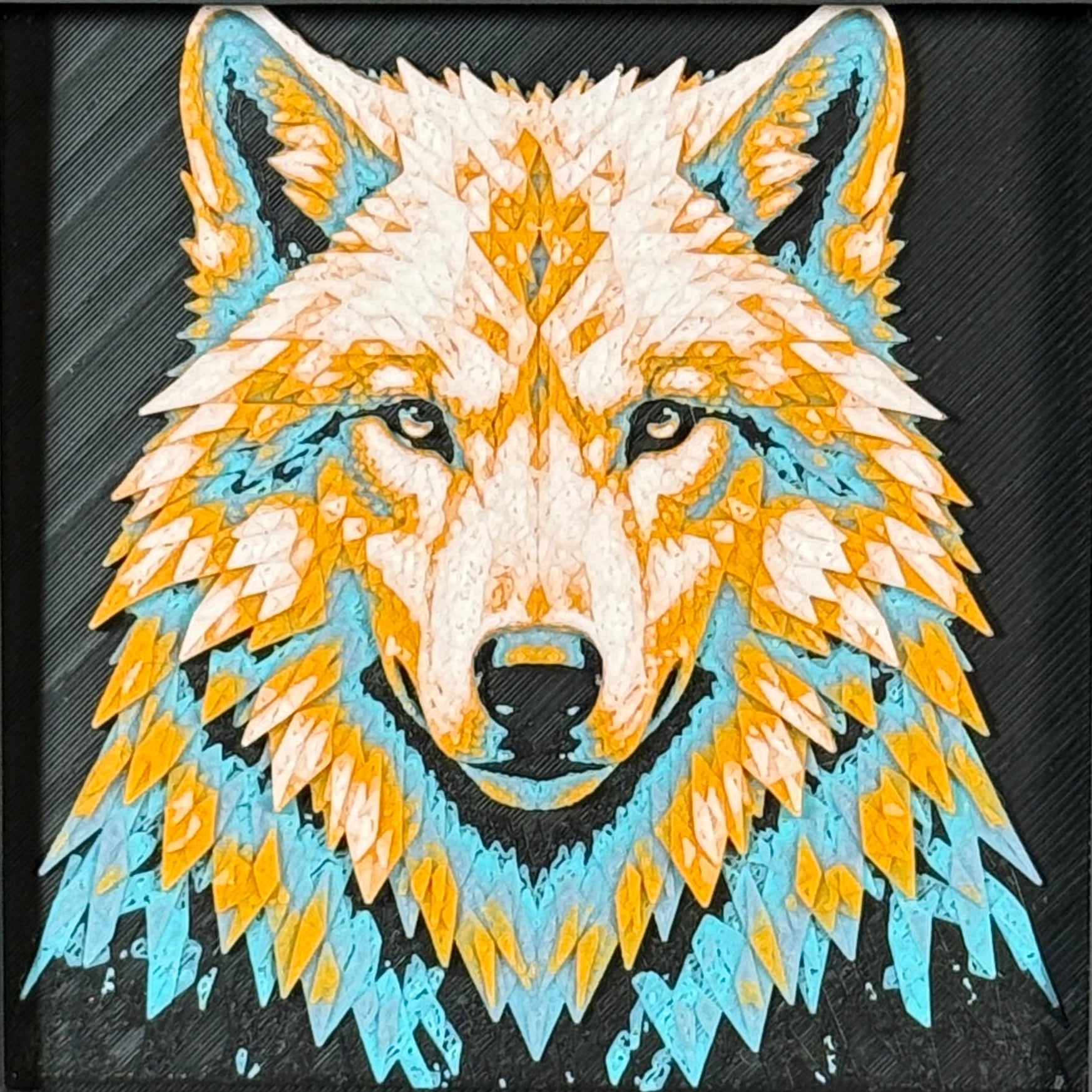 Geometric wolf framed layered 3D art in Teal Orange color palette, featuring a bold wolf portrait with turquoise, orange, black, and white layered details inside a charcoal matte display frame.