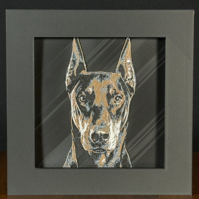 Framed 3D layered art piece featuring a highly detailed, textured portrait of a Doberman dog with erect, pointed ears, alert eyes, and a classic black and tan coat pattern.