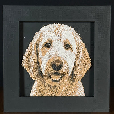 Framed 3D layered art piece featuring a highly detailed, textured portrait of a Goldendoodle dog with a curly golden coat, floppy ears, and alert, expressive eyes.