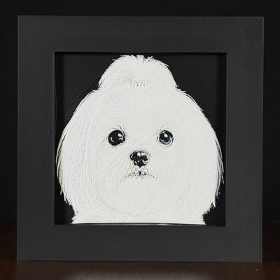 Framed 3D layered art piece featuring a highly detailed, textured portrait of a Maltese dog with dark expressive eyes, a fluffy topknot, and a classic white coat.