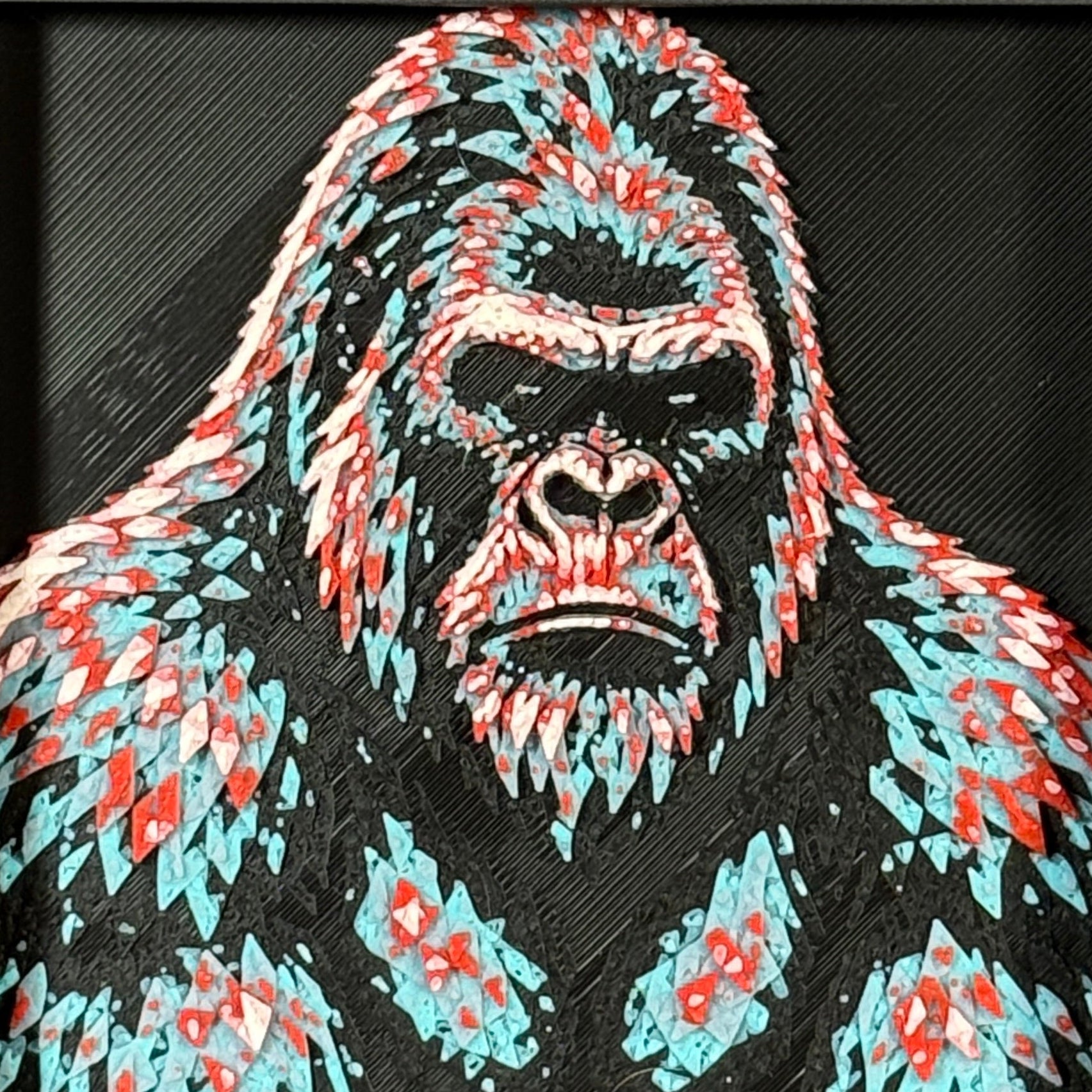 Geometric gorilla layered art in Crimson Ice palette in a black frame