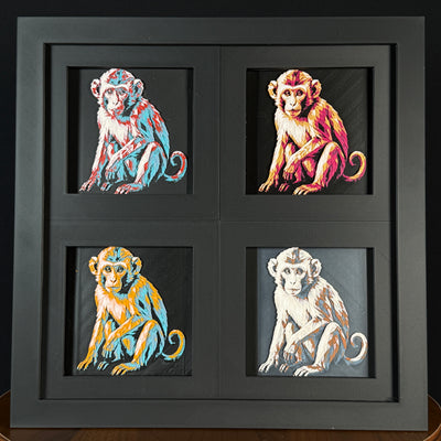 Geometric monkey layered art four-pack showing multiple color palettes in a black frame