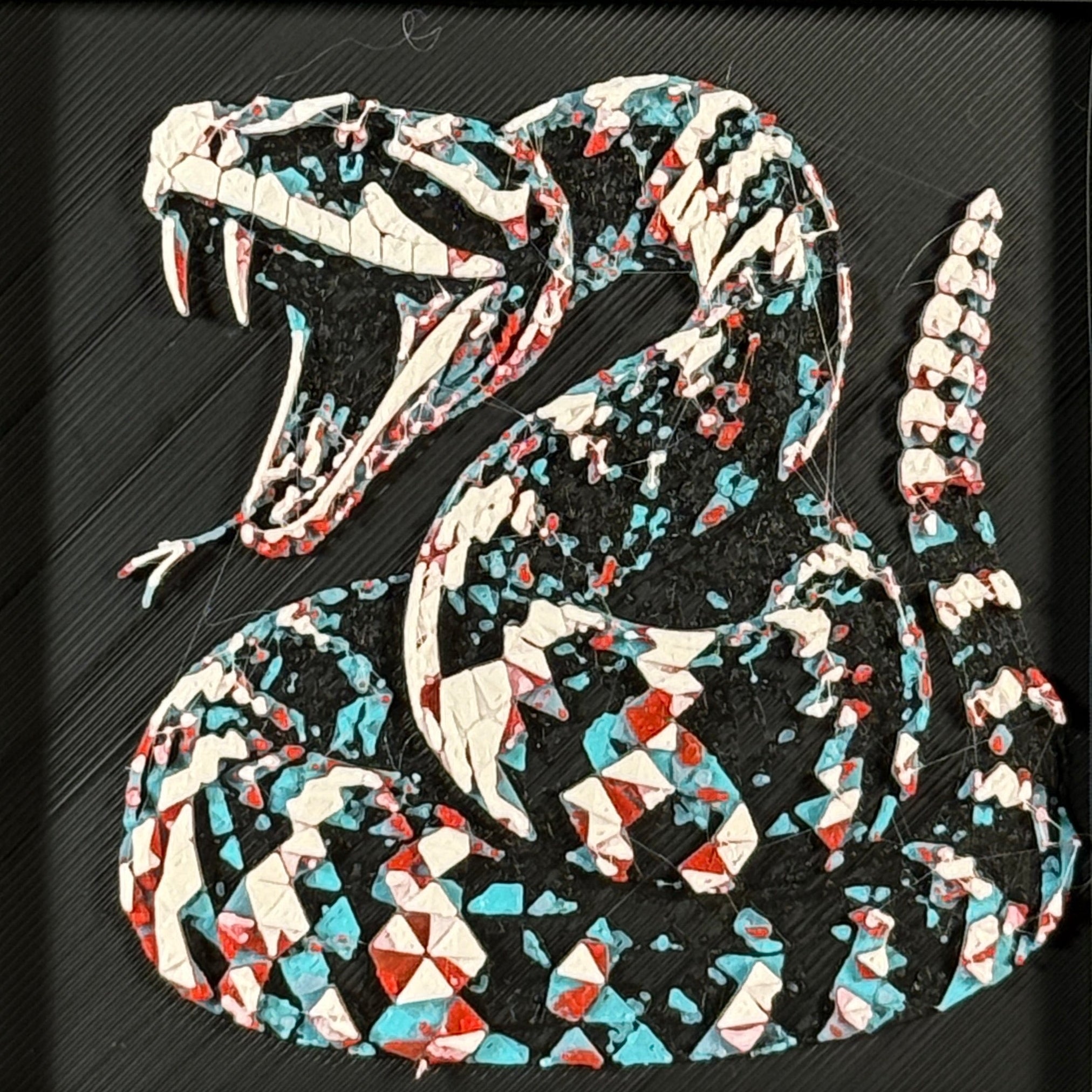 Geometric rattlesnake layered art in Crimson Ice palette in a black frame