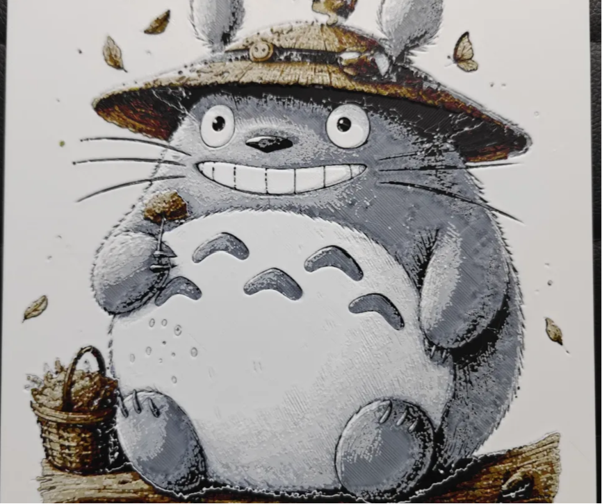 Framed 3D layered art piece featuring a detailed illustration of a large, round gray forest creature wearing a small straw hat, set against a light textured background.