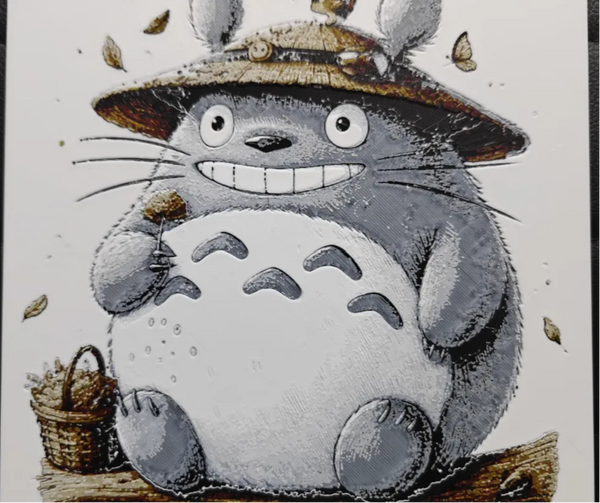 Framed 3D layered art piece featuring a detailed illustration of a large, round gray forest creature wearing a small straw hat, set against a light textured background.