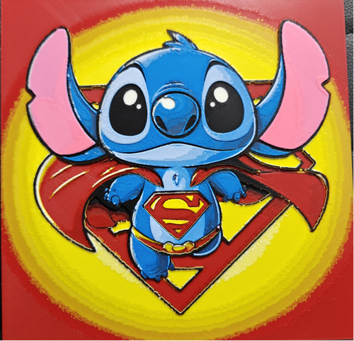 Framed 3D layered art piece featuring an adorable illustration of a cute blue alien character dressed as a classic comic book flying superhero, complete with a flowing red cape, yellow belt, and a red and yellow chest emblem, set against a large matching hero shield background.