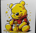 Framed 3D layered art piece featuring a heartwarming illustration of an adorable chubby yellow bear character wearing a red shirt, sitting happily amidst artistic paint splatters.