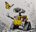 Framed 3D layered art piece from image_905303.png featuring a charming illustration of a boxy, curious scrap robot with expressive binocular eyes and a yellow chassis, looking up at a vibrant yellow and black butterfly fluttering above its outstretched hand in a detailed grayscale scrap landscape.