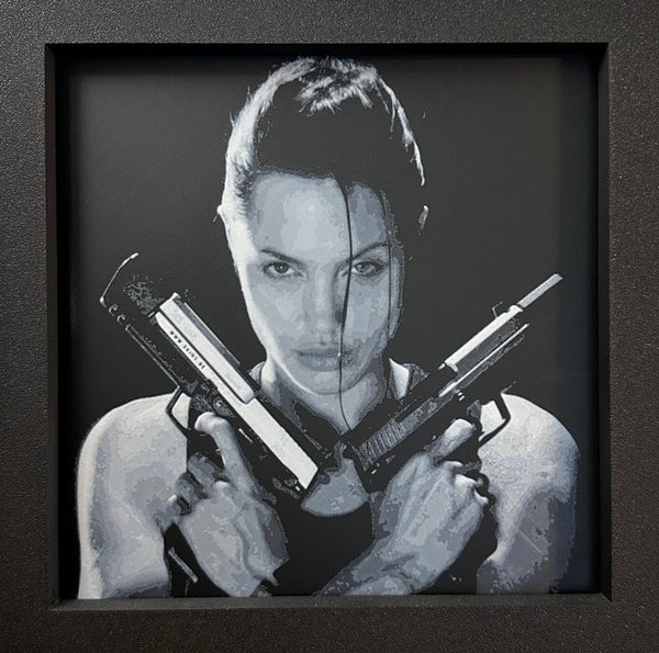 Framed 3D layered art piece featuring a dual pistol heroine in grayscale.