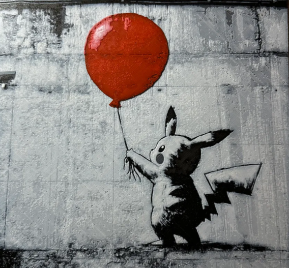 Framed 3D layered art piece featuring electric mouse with red balloon layered art in grayscale and red palette