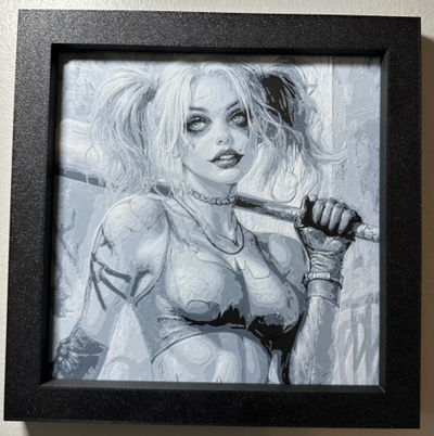 Framed 3D layered art piece featuring a monochrome sketch-style portrait of a popular comic book villainess with pigtails holding a baseball bat, displayed inside a deep black frame.