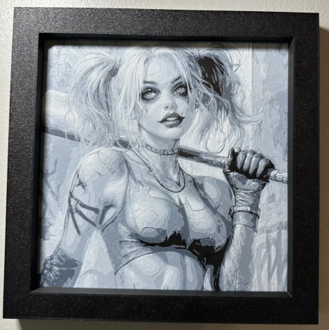 Framed 3D layered art piece featuring a monochrome sketch-style portrait of a popular comic book villainess with pigtails holding a baseball bat, displayed inside a deep black frame.