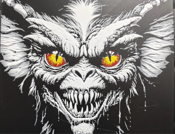 Monster face horror framed layered 3D art with red and yellow eyes