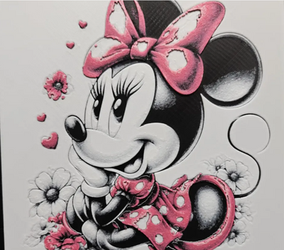 Framed 3D layered art piece featuring a stylized classic cartoon mouse smiling with a bright pink polka dot bow and matching dress, accented with pink splatter details on a light background.