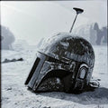 Framed 3D layered art piece featuring a sci-fi bounty hunter helmet in grayscale.