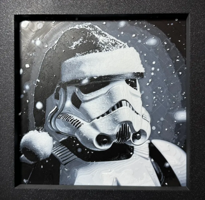 Framed 3D layered art piece featuring sci-fi holiday trooper layered art in grayscale palette in a black frame