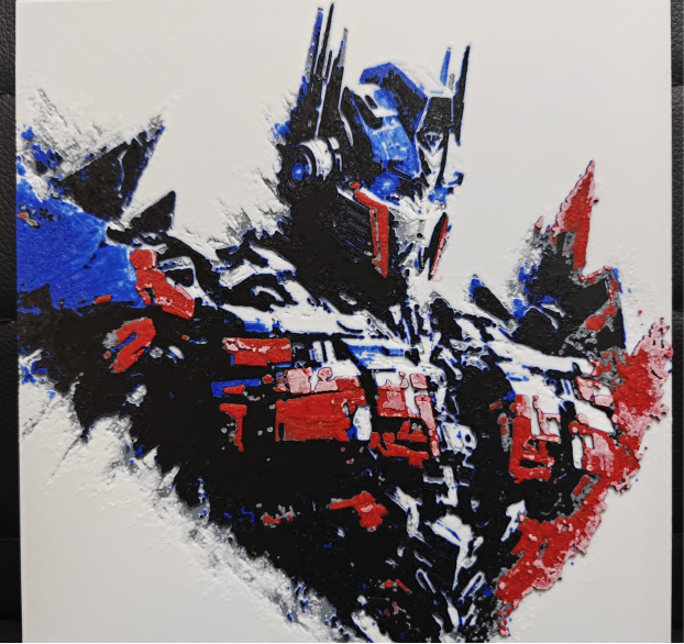 Framed 3D layered art piece featuring a detailed illustration of a powerful sci-fi robot leader character in iconic red and blue armor plating, shown in a dynamic heroic pose against a light background.