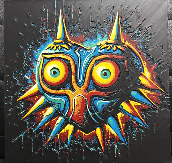 Framed 3D layered art piece featuring a bold graphic illustration of an iconic tribal heart-shaped mask with large yellow eyes and colorful spikes against a dark background.