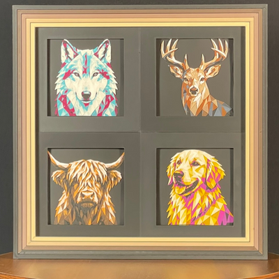 Framed geometric layered art 4-pack featuring a wolf, whitetail deer, Highland cow, and golden retriever arranged in a premium 2x2 display frame.