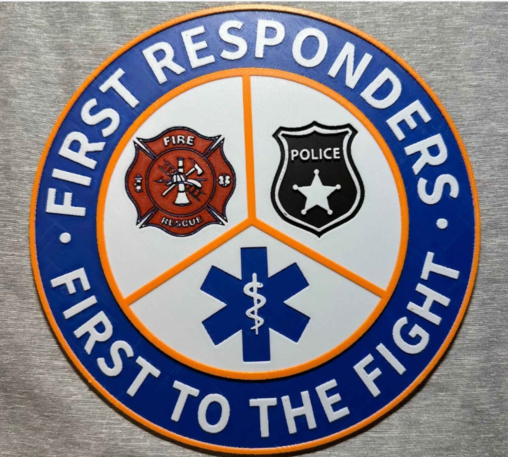 Framed 3D layered art piece featuring the First Responders emblem with colorized accents.