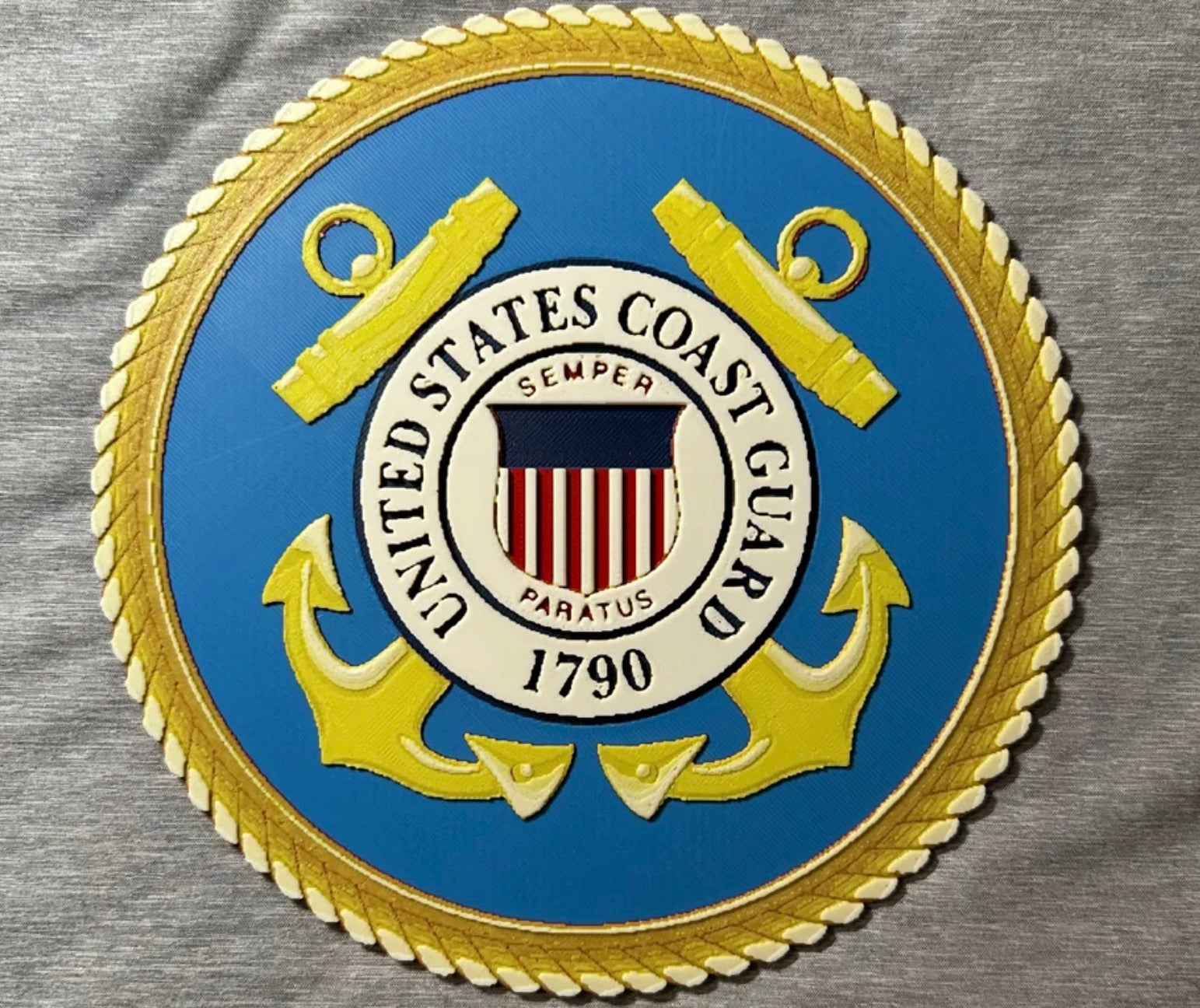 Framed 3D layered art piece featuring the U.S. Coast Guard emblem on a gray background.