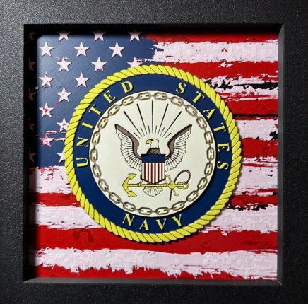 Framed 3D layered art piece featuring U.S. Navy emblem over stylized American flag in red white and blue